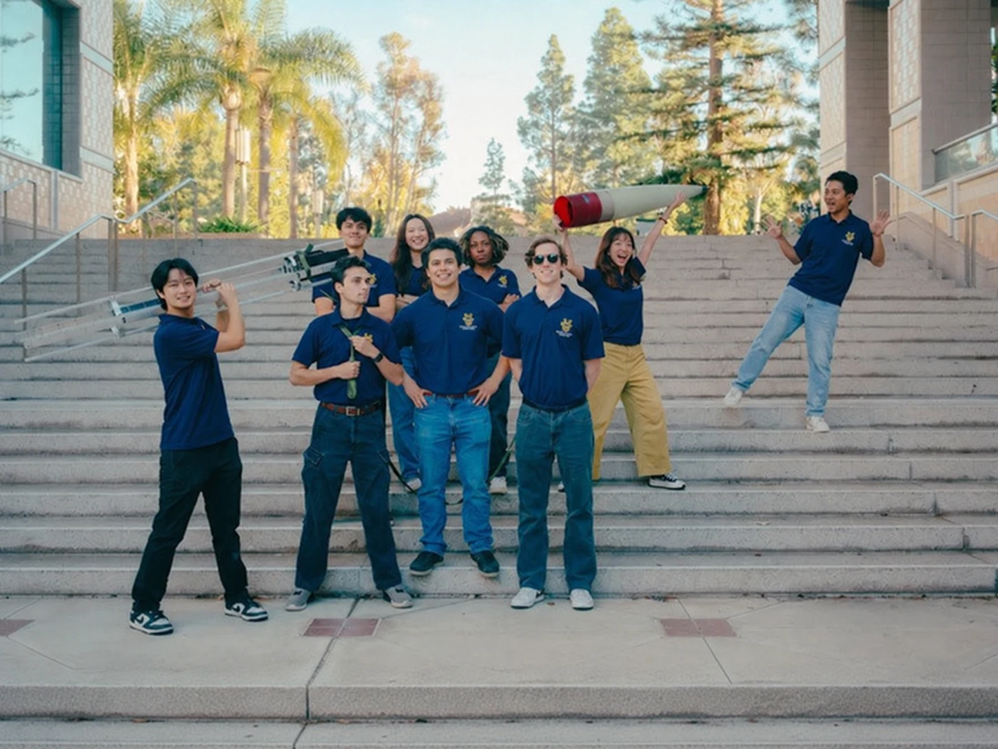 The Launch Vehicle team with rocket components on the campus steps